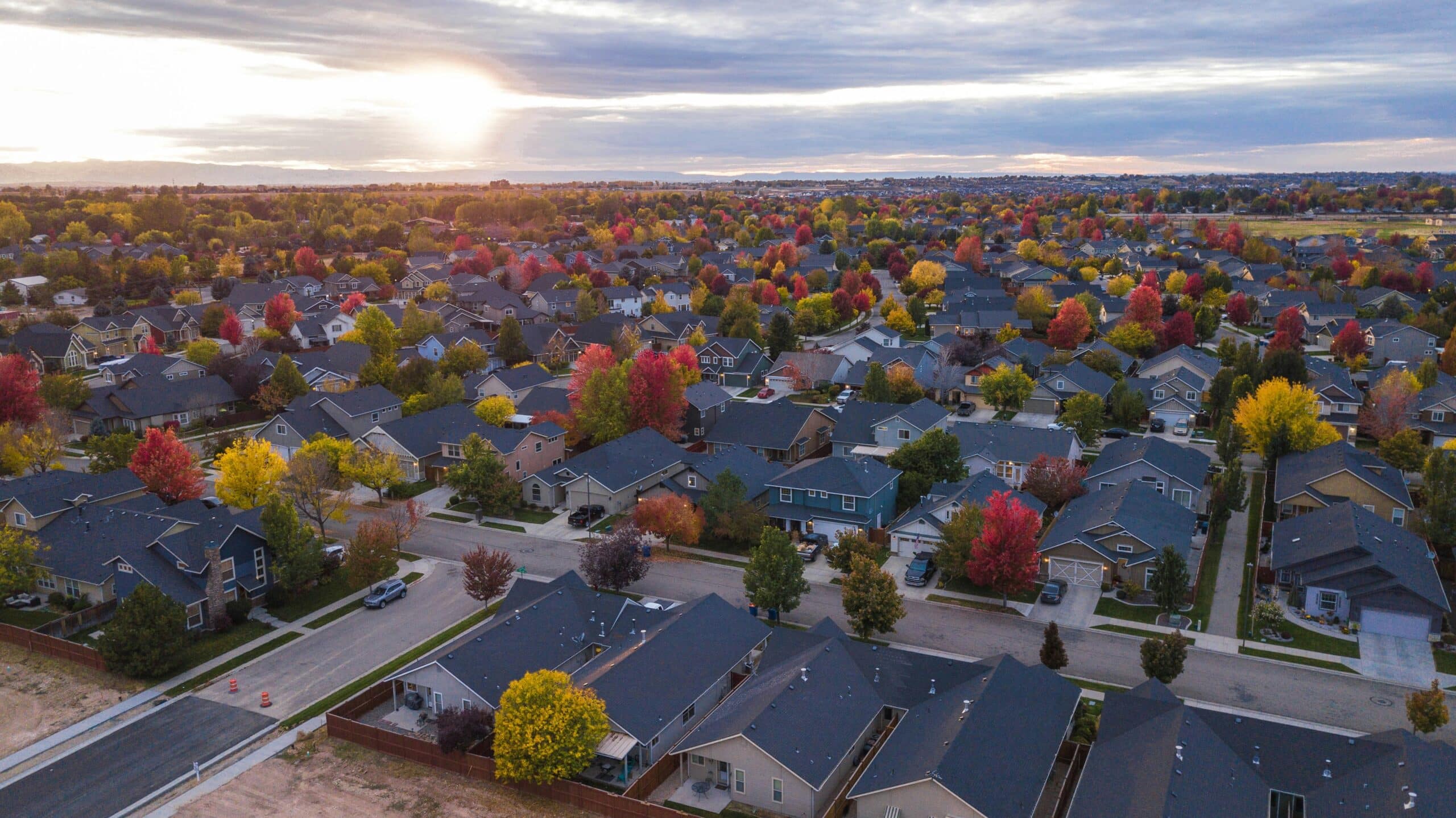 Colorful autumn trees over suburban neighborhood